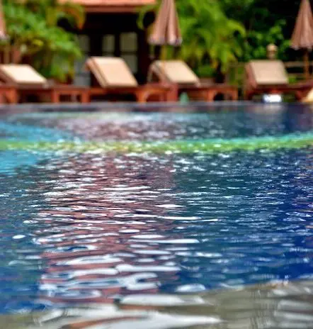 Outdoor pool with lounge chairs