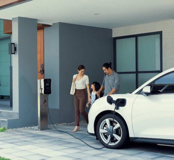 Family with electric vehicle charging